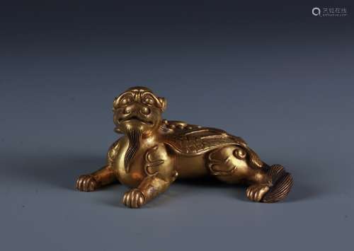 A FINELY CAST GILT BRONZE BEAST WEIGHT