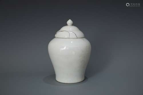 A Carved Dragon White-Glazed Jar