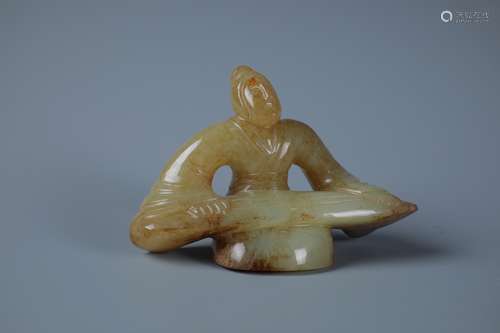 A RARE CELDON AND RUSSET JADE CARVING OF  SCHOLOR