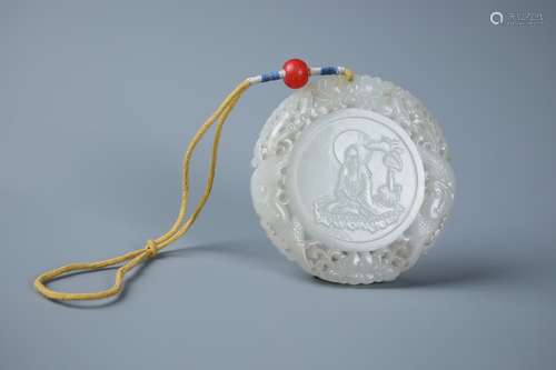 AN INSCRIBED WHITE JADE 'IMMORTAL' CIRCULAR PENDENT