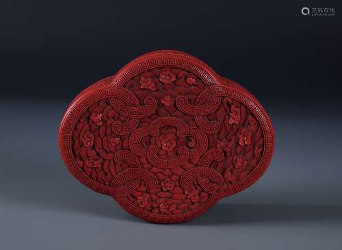 AN UNUSUAL AND FINELY CARVED CINNABAR LACQUER