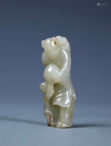 A CARVED CHINESE WHITE JADE FIGURE AND PEACH