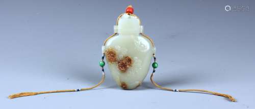 A FINELY CARVED WHITE AND RUSSET JADE  VASE AND COVER