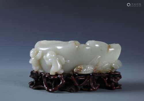 A FINELY CARVED CHINESE WHITE JADE BOYS LINGZHI FORM