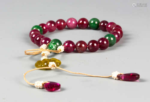 A CHINESE TOURMALINE AND JADEITE ROSARY BRACELET