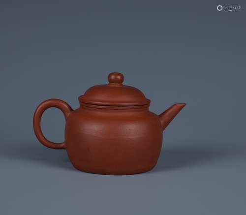 A SMALL YIXING ZISHA TEAPOT AND COVER