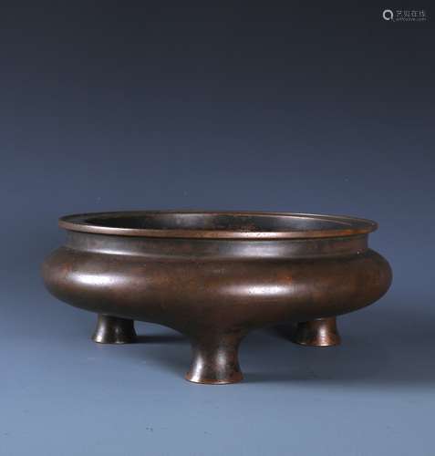 A CHINESE BRONZE TRIPOD CENSER