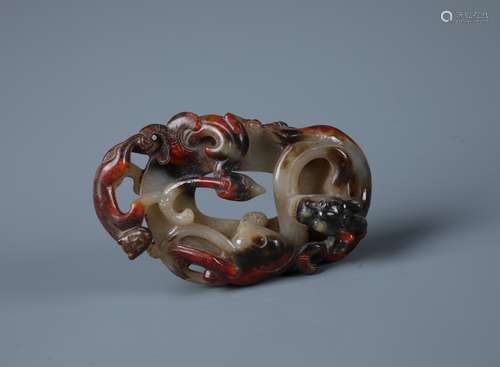 A CHINESE GREYISH RED JADE 'DRAGON AND PHOENIX'PENDENT