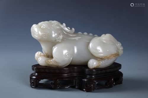 A SUPERB CHINESE WHITE JADE CARVING OF MYTHICAL BEAST