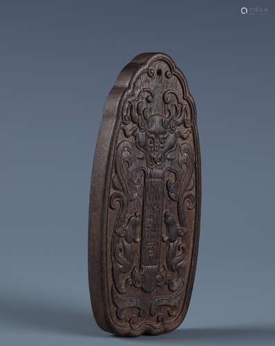 A CHINESE CARVED ALOESWOOD 'CHILONG'PENDENT PLANQUE