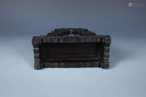 A FINELY CARVED CHINESE ZITAN STAND WITH BAND OF LOTUS