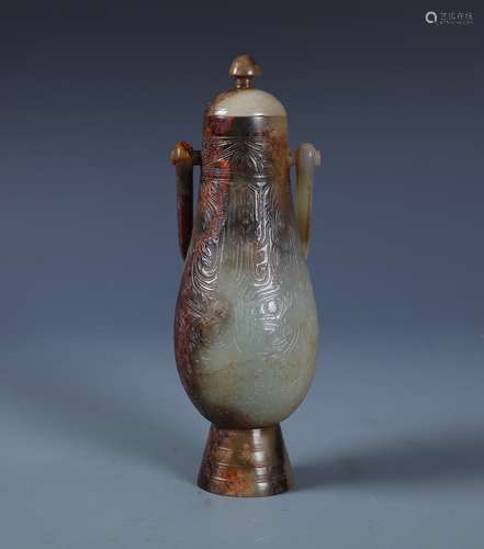 A Celadon and Russet Jade Archaistic Handled Vase And