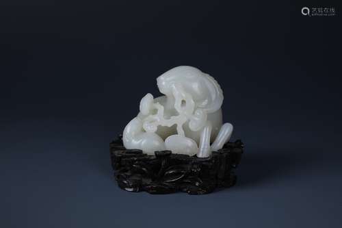 A FINELY CARVED CHINESE WHITE JADE GOAT