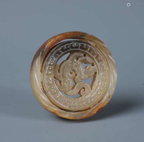 A Celdon and Russet Jade Circular Chilong Pendent