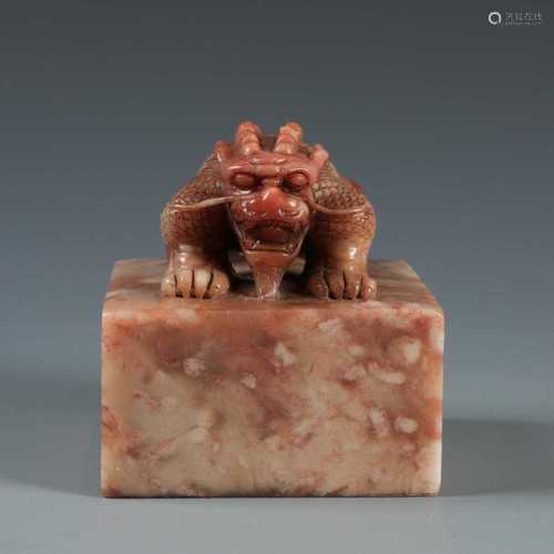 A FINELY CARVED RED SOAPSTONE MYTHICAL BEAST SEAL