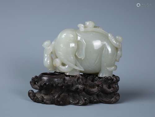 A RARE CHINESE WHITE JADE CARVING  WITH ZITAN STAND