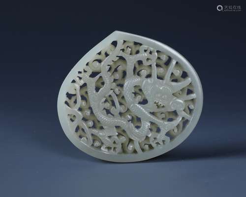 A FINELY CARVED CHINESE WHITE JADE OPENWORK DRAGON