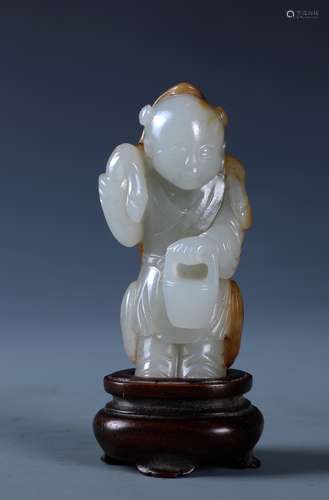 A RARE CARVED CHINESE WHITE AND RUSSET JADE FIGURE