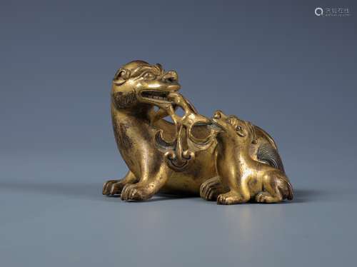 A SMALL FINELY CAST GILT-BRONZE MYTHICAL TWIN