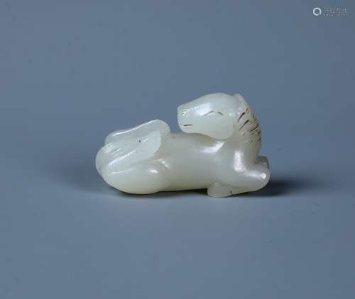 A FINELY CARVED MINIATURE JADE HORSE