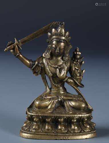 A GILT-BRONZE FIGURE OF MANJUSHRI