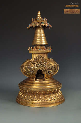 AN OLD PAGODA DESIGN GILT BRONZE ORNAMENT