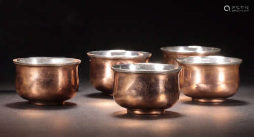 A SET OF SILVER BRONZE CUPS
