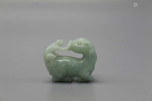 Chinese carved jadeite figure of monkey riding on a horse.