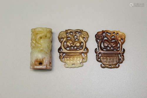 Three Chinese carved jade pendants.