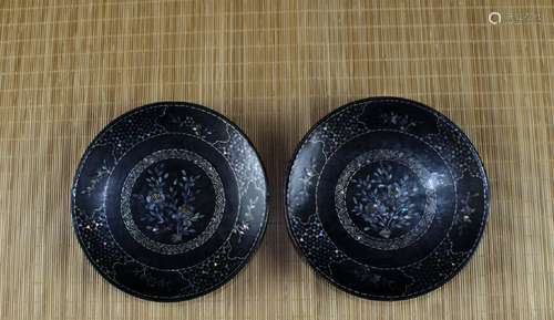 Pair of Chinese lacquer dishes with mother of pearl inlaid decoration.