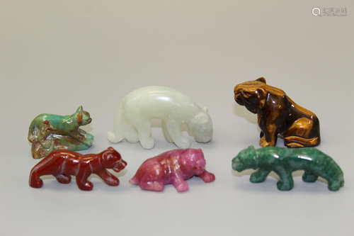 Six Chinese carved stone animals.