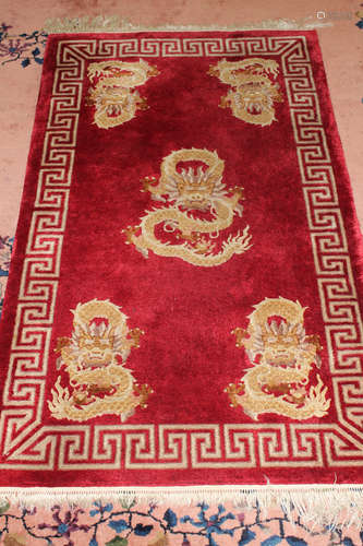 Chinese red silk rug.