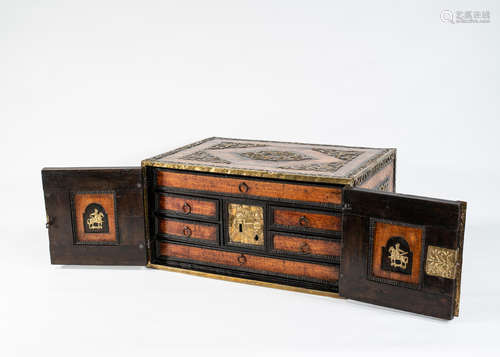 A North European 17th century elm, walnut and brass mounted table cabinet