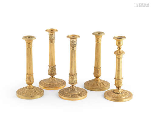 Two pairs of French 19th century gilt-bronze candlesticks