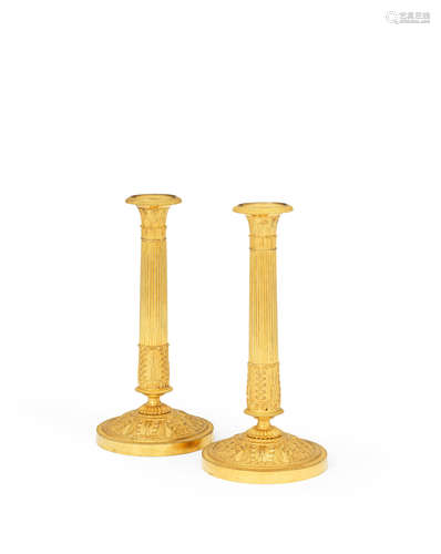 A pair of 19th century French gilt metal candlesticks