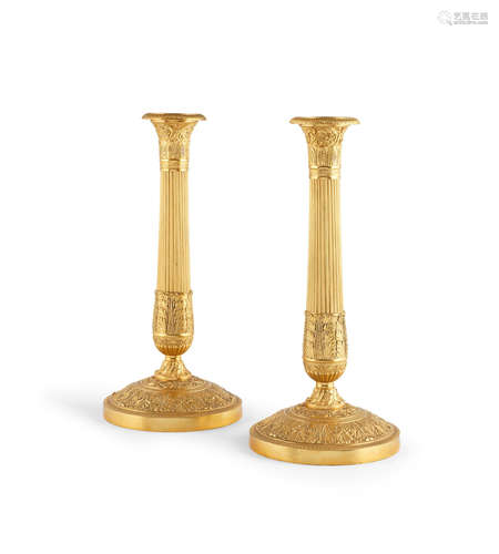 A pair of 19th century French gilt metal candlesticks