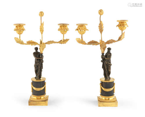 A pair of French 19th century patinated and gilt-bronze twin branch candelabra