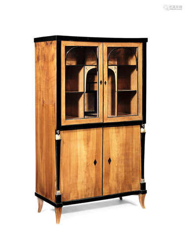 A Biedermeier cherrywood and ebonised display cabinet