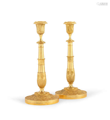 A pair of French 19th century gilt bronze candlesticks