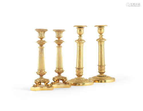 In the Empire style A pair of French 19th century gilt-bronze candlesticks