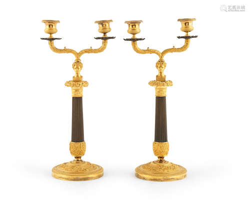 A pair of 19th century French gilt and patinated bronze candelabra