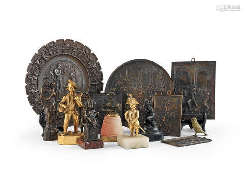 A collection of bronze figures and plaques