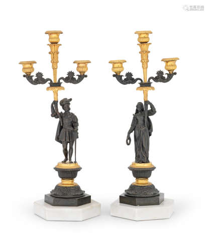 A pair of French 19th century gilt and patinated bronze candlesticks