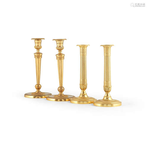 A pair of French early 19th century gilt bronze candlesticks