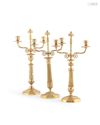 A matched set of three French 19th century gilt-bronze candelabra