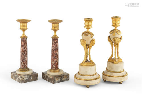 In the Louis XVI style A pair of French late 19th century gilt-bronze and marble candlesticks