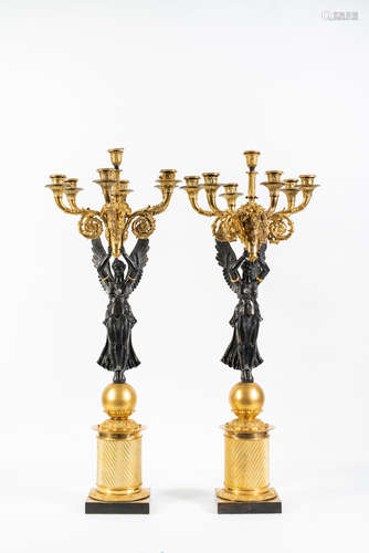 In the manner of Pierre-Philippe Thomire A large pair of French 19th century gilt and patinated bronze six branch candelabra