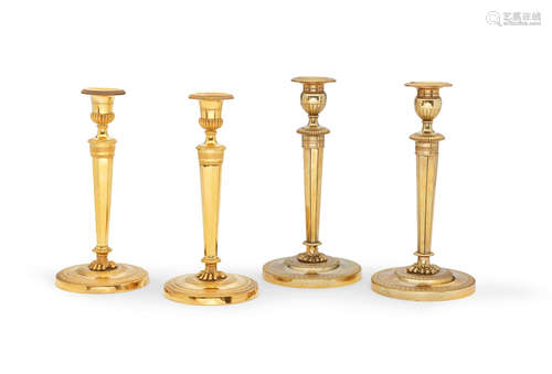 Two pairs of French late 19th century gilt-bronze candlesticks