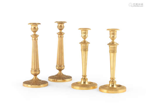 A pair of French gilt-metal candlesticks