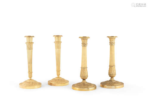 Two pairs of French 19th century gilt-bronze candlesticks